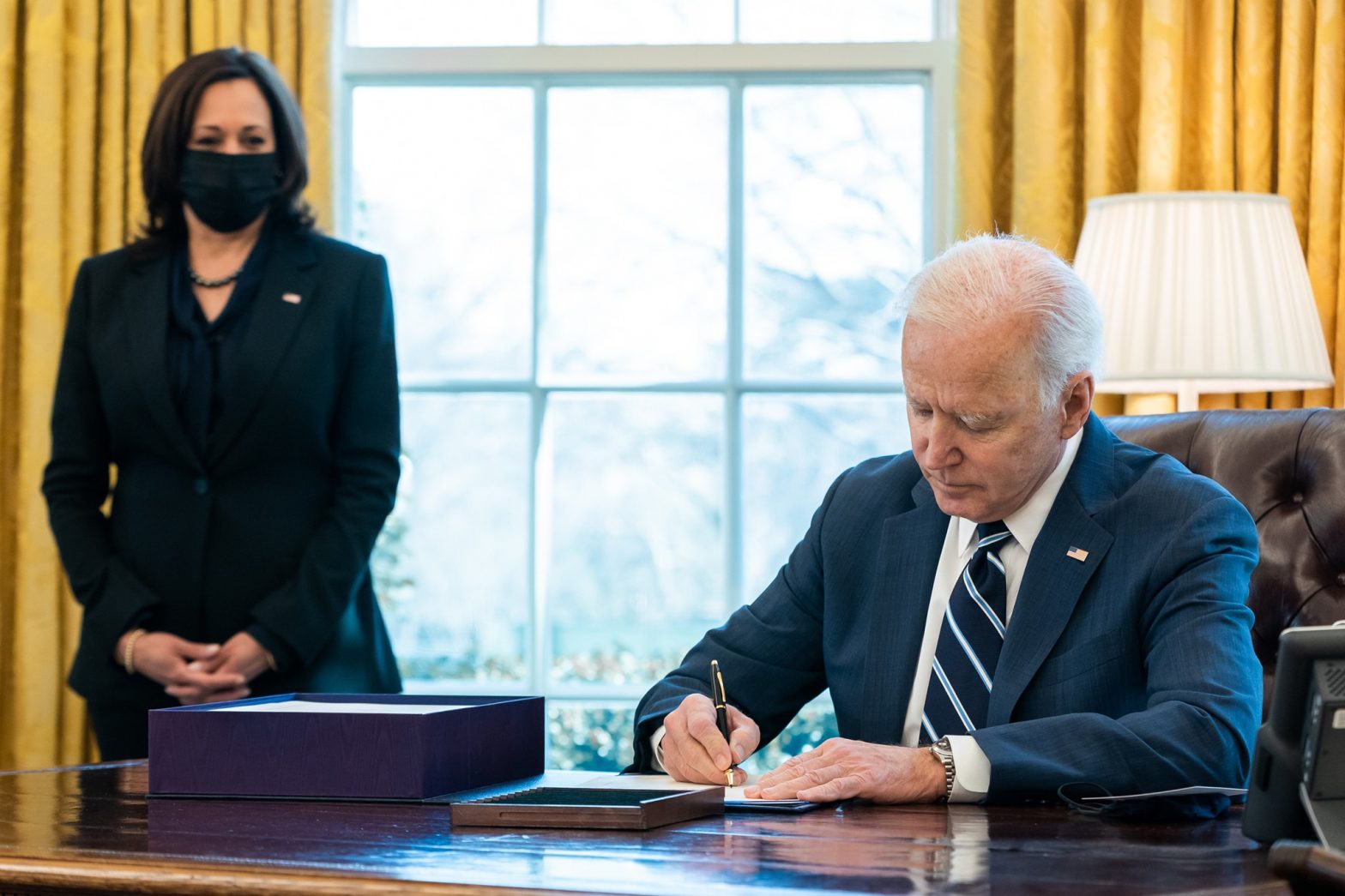 President Joe Biden signs the American Rescue Plan