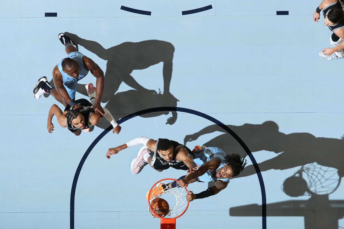 An aerial view of Ja Morant dunking on Victor Wembanyama.