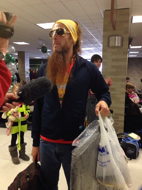 A passenger leaving the first Frontier flight from Denver