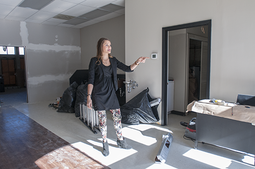 Alexandra stands in the space being renovated for Pageboy Salon