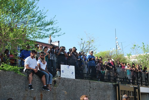 An overflow crowd gathered on the hill that overlooks the museum.