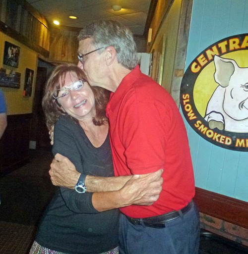 Chris Caldwell, winner in a tight three-way race for the District  1 seat on the Unified School Board, bestows a celebration kiss on wife Cheryl.