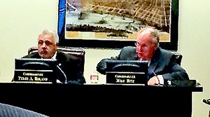 Commissioners Roland and Ritz during debate on the schools capital spending