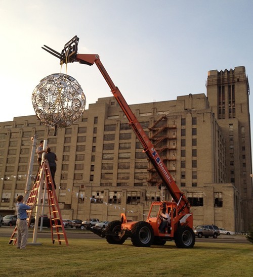 Eli Gold and Colin Kidder install their Beacon sculpture.