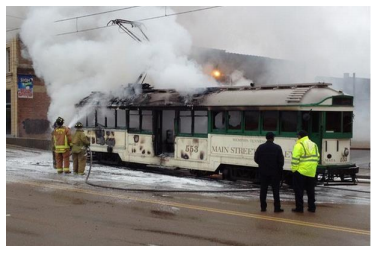 Firefighters extinguish trolley No. 553 in June.