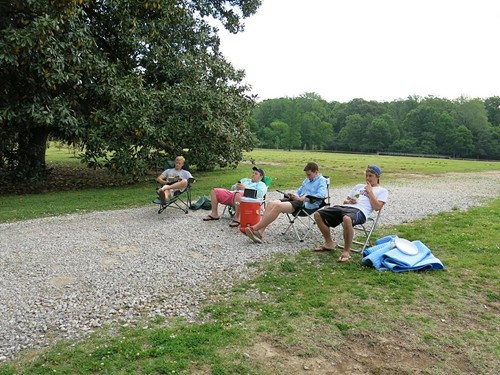 Get Off Our Lawn protestors block the gravel drive to the Greensward at Overton Park.