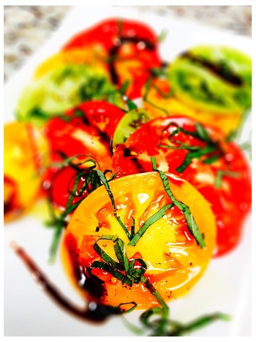 Heirloom Tomatoes with basil, olive oil, and a balsamic reduction