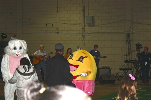 In the Plipkin Building, children dance with Easter-themed characters while local band the Mason Jar Fireflies performs.