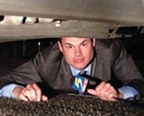 Jason under a car