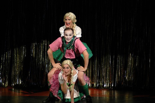 Jonathan Christian (center) as the Emcee  is sandwiched by “Two Ladies”, Rebecca Brown (top) and Maia Hankin (bottom), in Cabaret at Theatre Memphis, March 11 ”“ April 3, 2011.