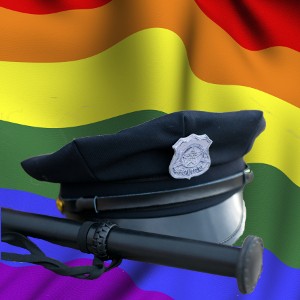 Police-cap-and-truncheon-on-rainbow-suface-ripple.jpg