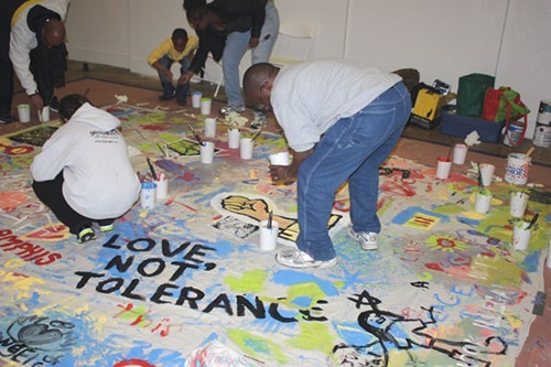 Memphians working on a banner promoting equality.