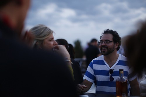 Michael Hughes mixing his signature bourbon drink.