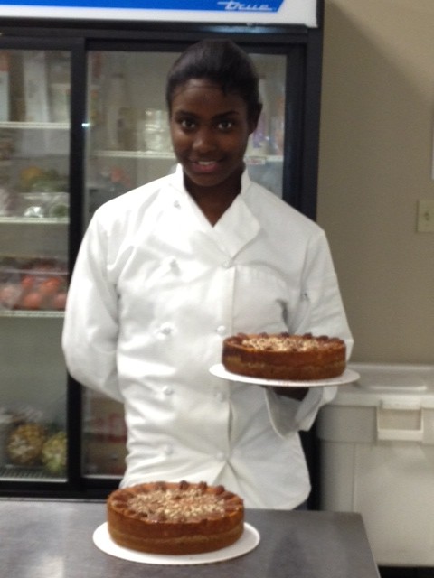 Eron Jackson, holding a cheesecake