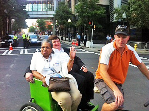 Ruby Wharton and John Freeman share a ride in Charlotte.