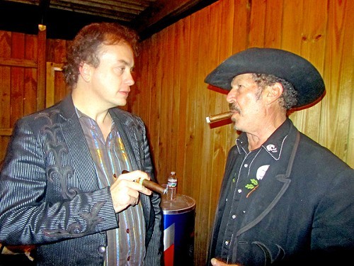 Sometimes, as Freud said, a cigar is just a cigar. Here, Kinky Friedman goes head-to-head with Folk Alliance attendee Dean Baxter.