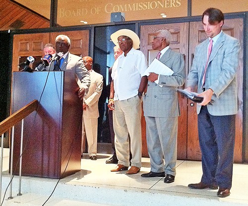 Walter Bailey, chairman of County Commissions education committee, reads MOU at press conference.