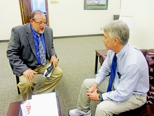 Witness Richard Archie (left) and Commissioner Steve Mulroy disagreed Monday on a gun-rights resolution, bur Archie, husband of a transplant recipient, made it  a point later on to congratulate Mulroy for his planned surgery next week to donate a kidney to a local organ bank.